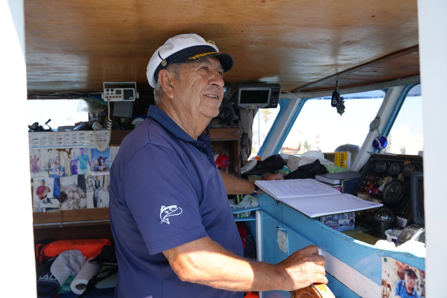 Captain Alex at the wheel of the Captain Tasos in Kos Harbour