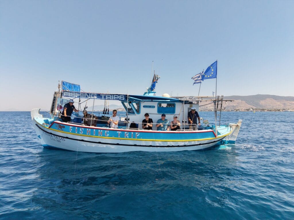 Guests fishing from the rail of the Captain Tasos on the Aegean off Kos