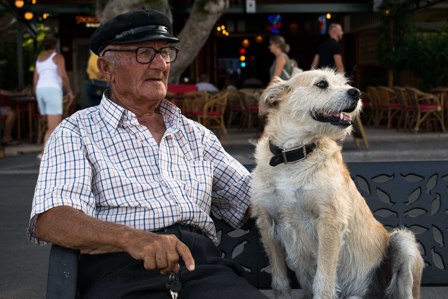 Captain Tasos sitting with his dog in Kos Town