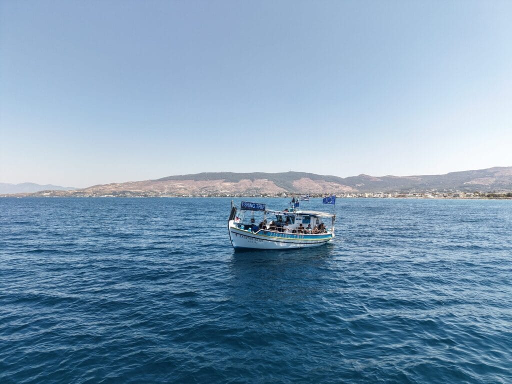 The Captain Tasos on open water with the Kos coastline behind