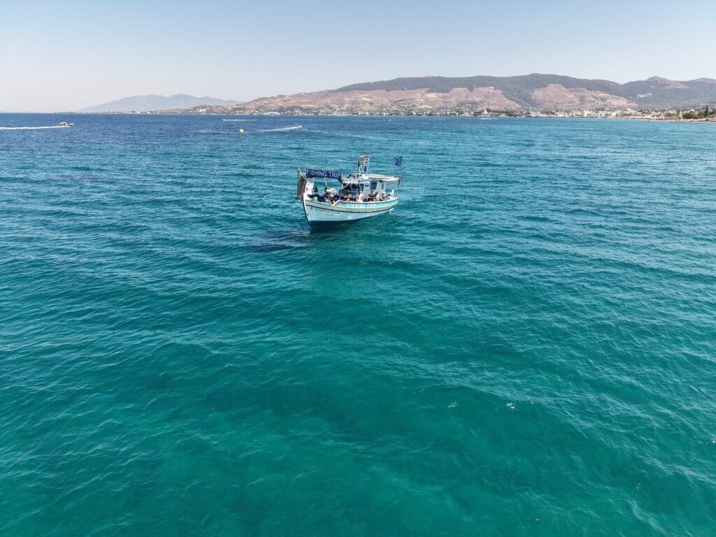 Aerial view of the Captain Tasos on clear turquoise water near Kos
