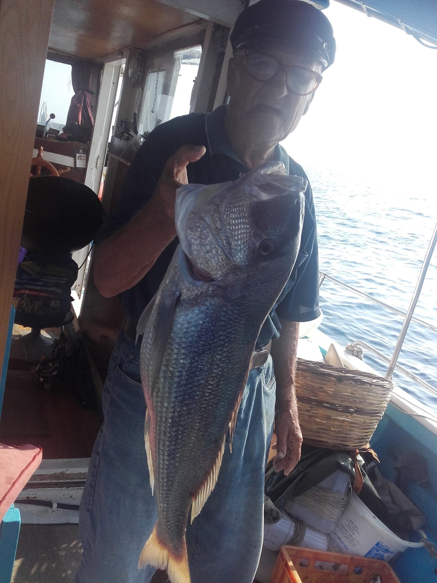 August 2016. Captain Tasos on board with a fish from that morning.