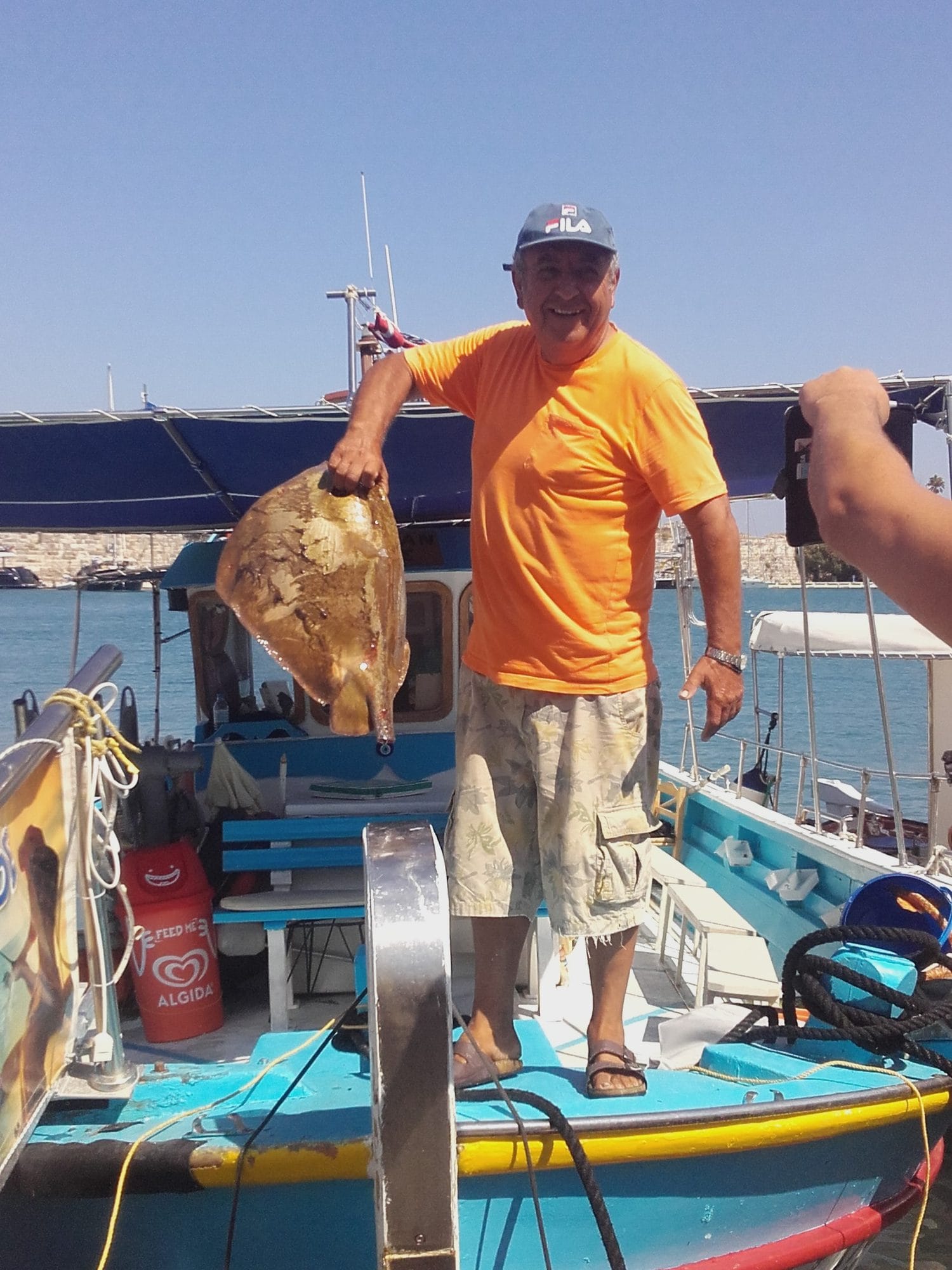 September 2016. Alex holding a sole caught off Kos.
