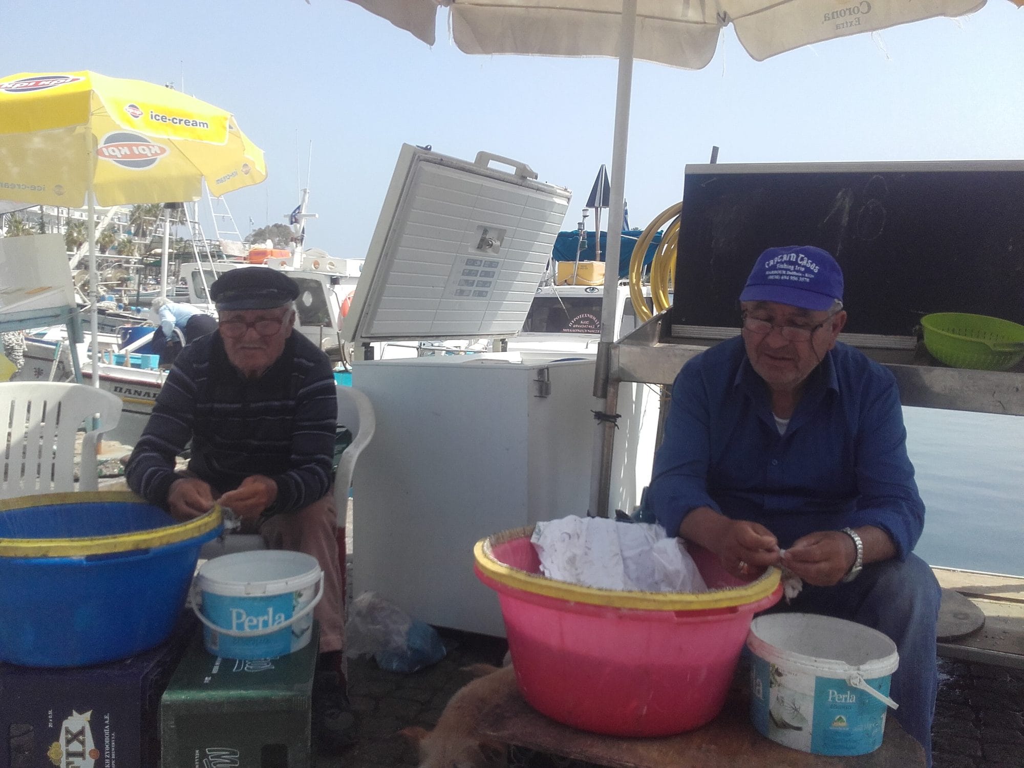 April 2018. Alex and his father baiting the longlines on the quay.